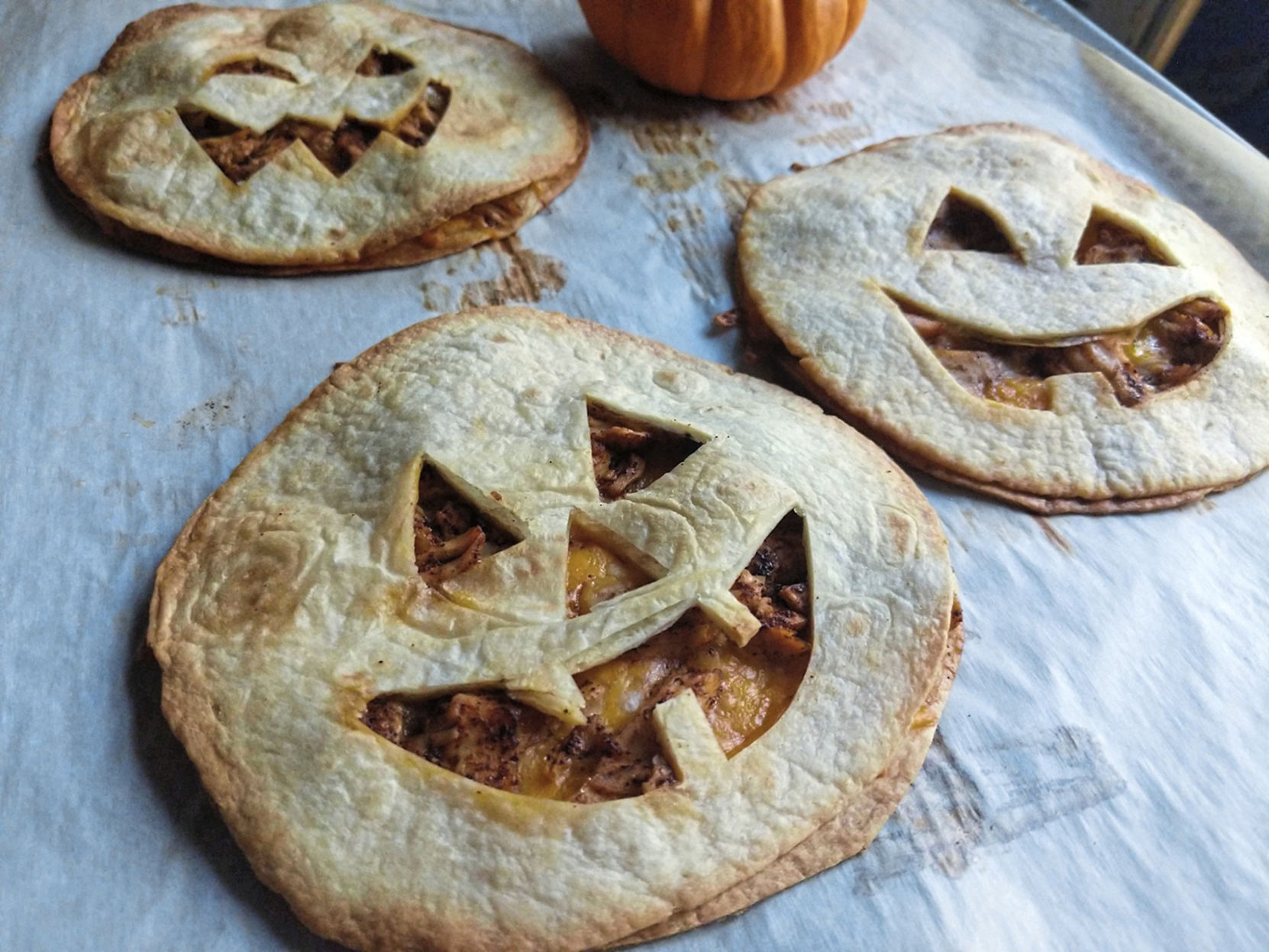 Stuffed with chicken and cheese, jack-o'-lantern quesadillas make a quick and easy dinner on Halloween.
